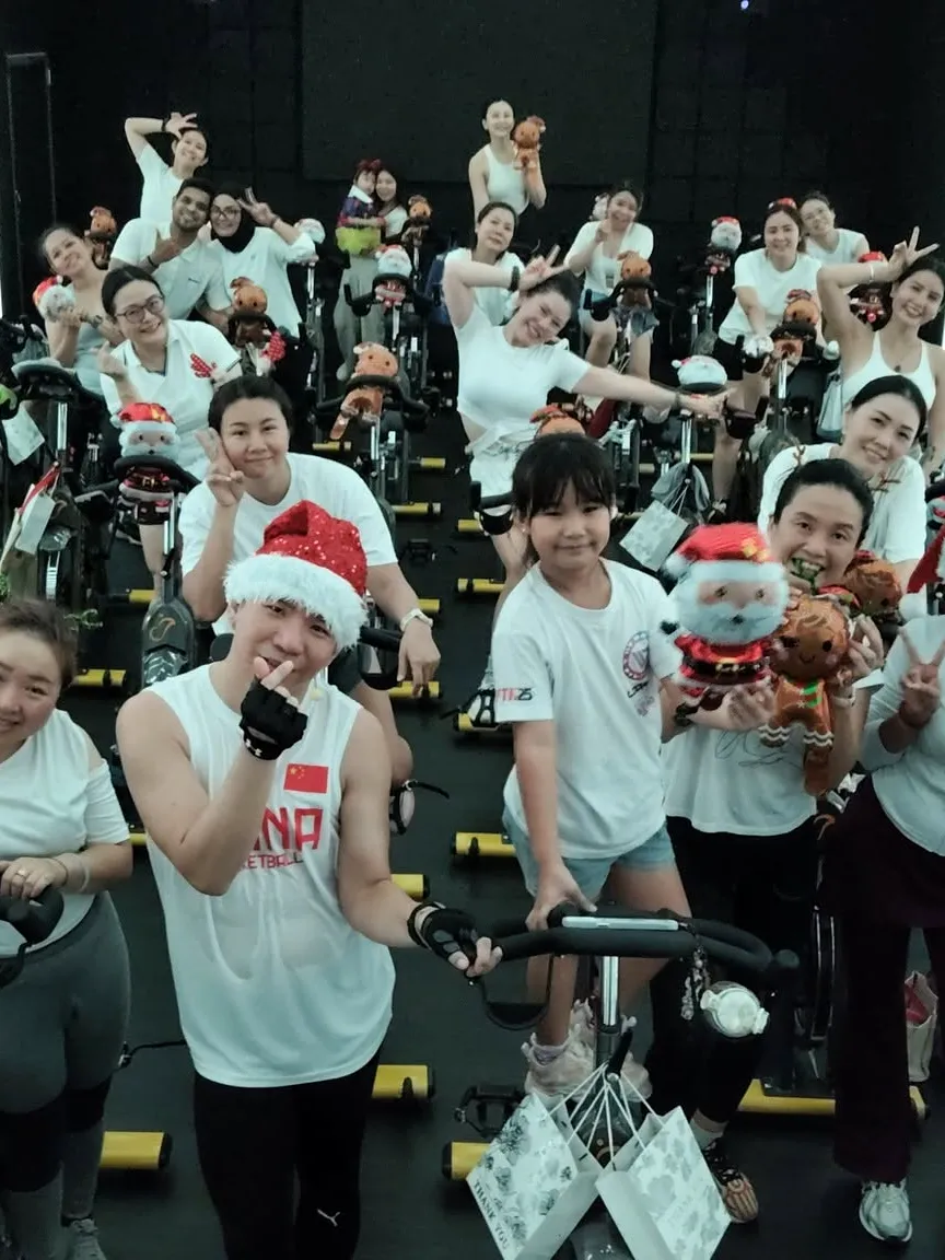 A full J Cycle class at a themed ride, riders of every age on the bikes